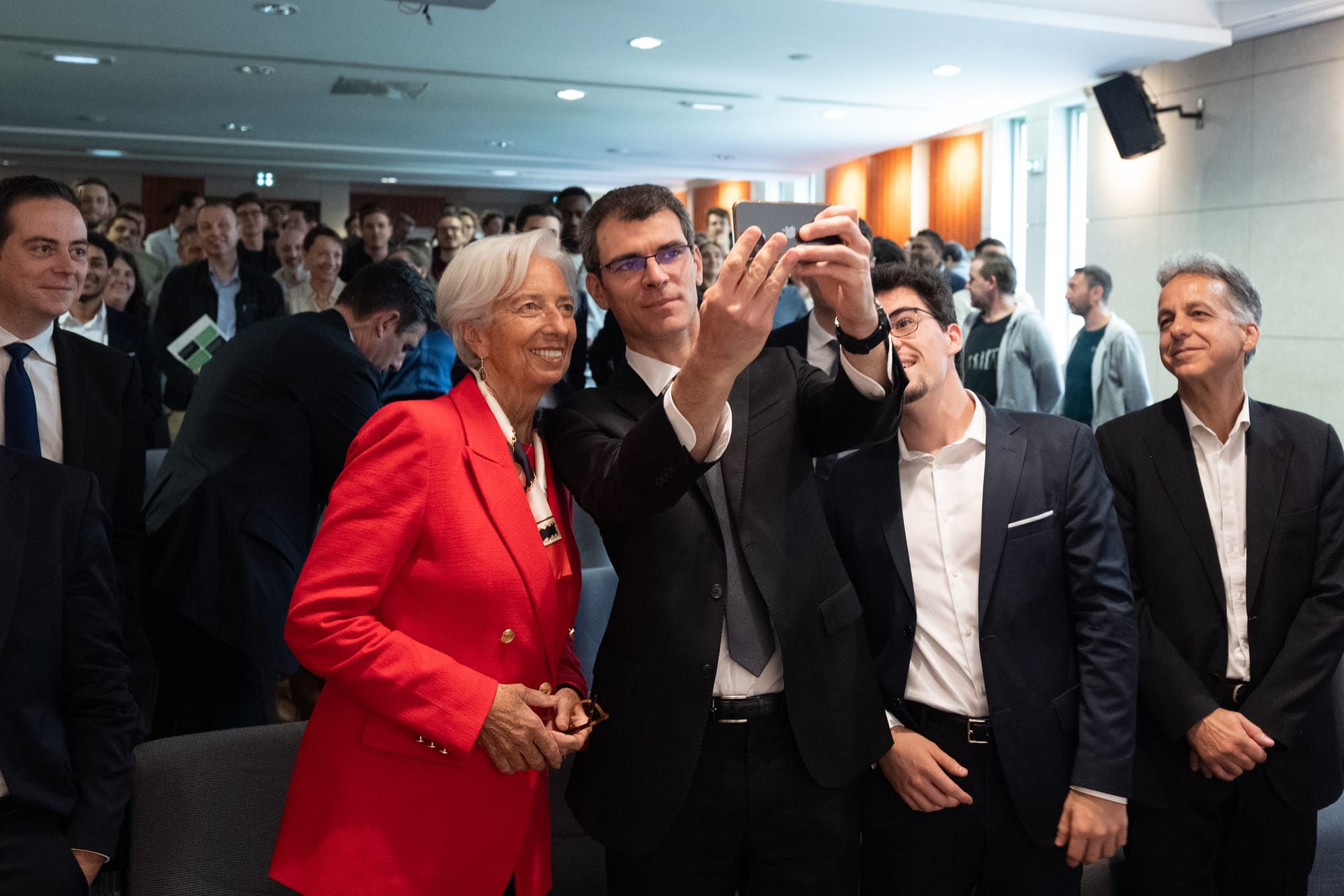 Georges-Olivier Reymond snaps a selfie with Lagarde (Photo by Martin Lamberts / ECB)